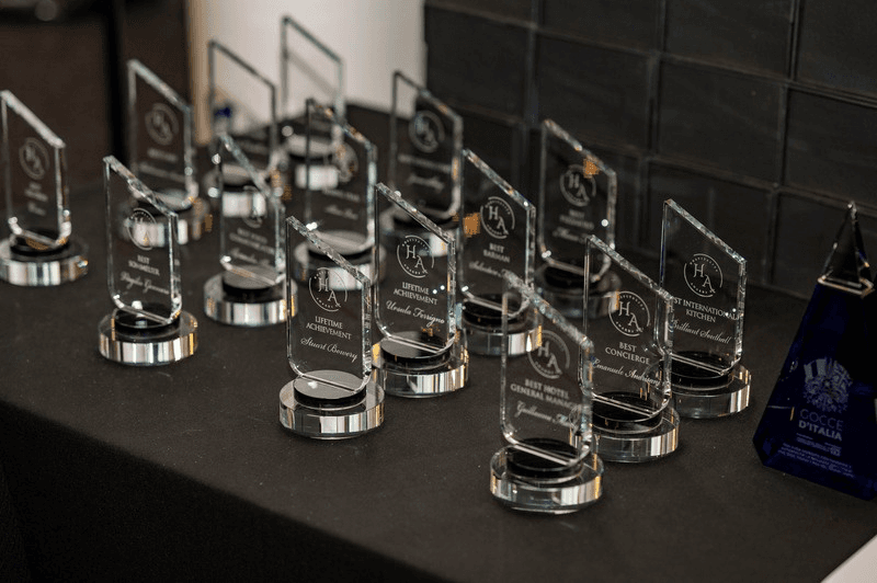Engraved glass trophies lined up ahead of the awards ceremony