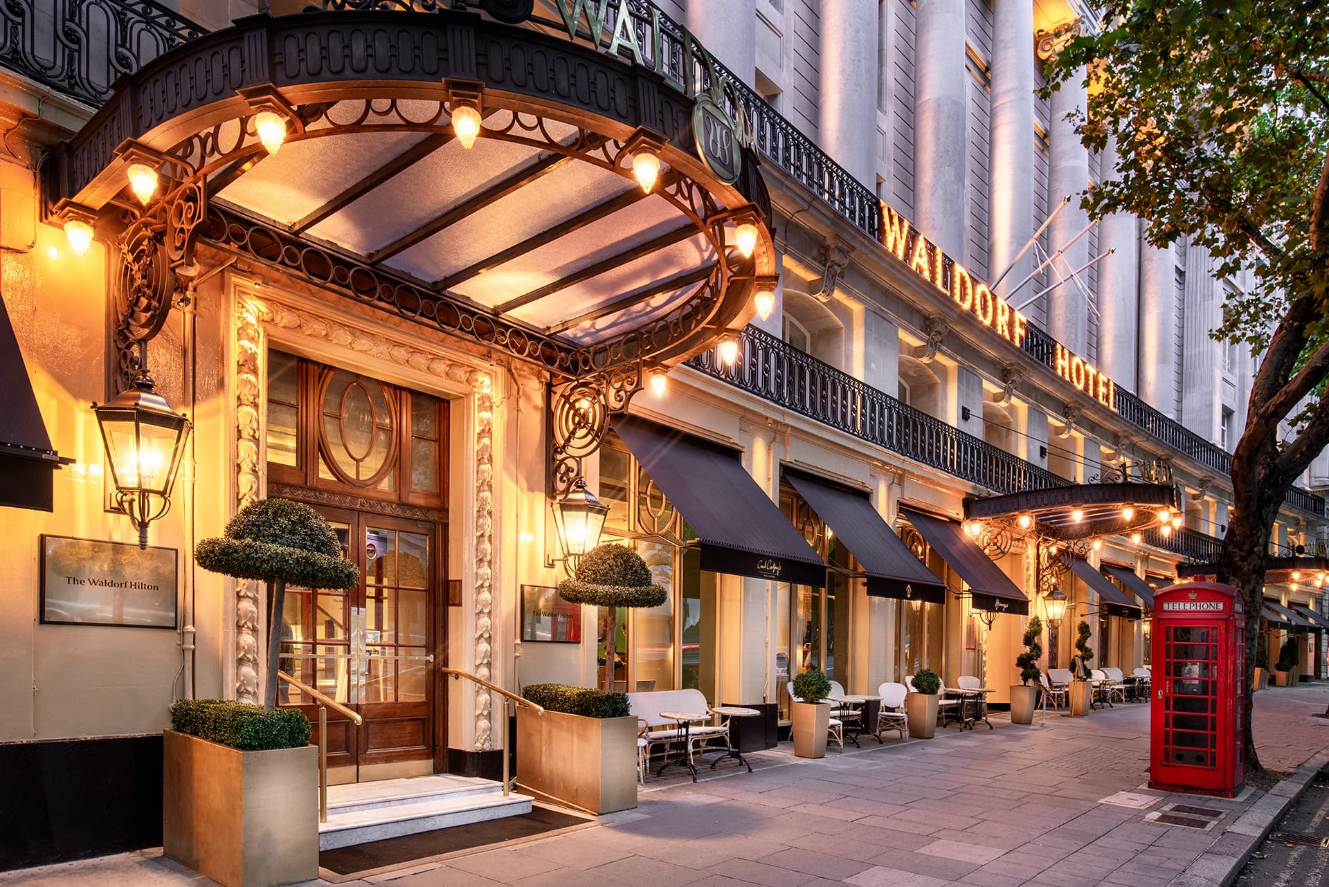The entrance canopy of The Waldorf Hilton on Aldwych at dusk